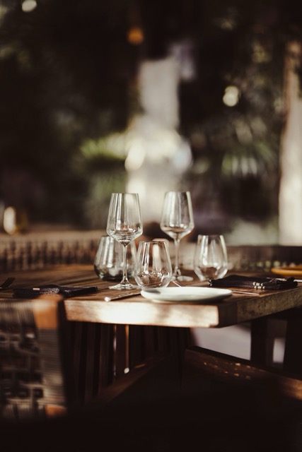 wine and water glasses at a table in a fine dining hospitality restaurant