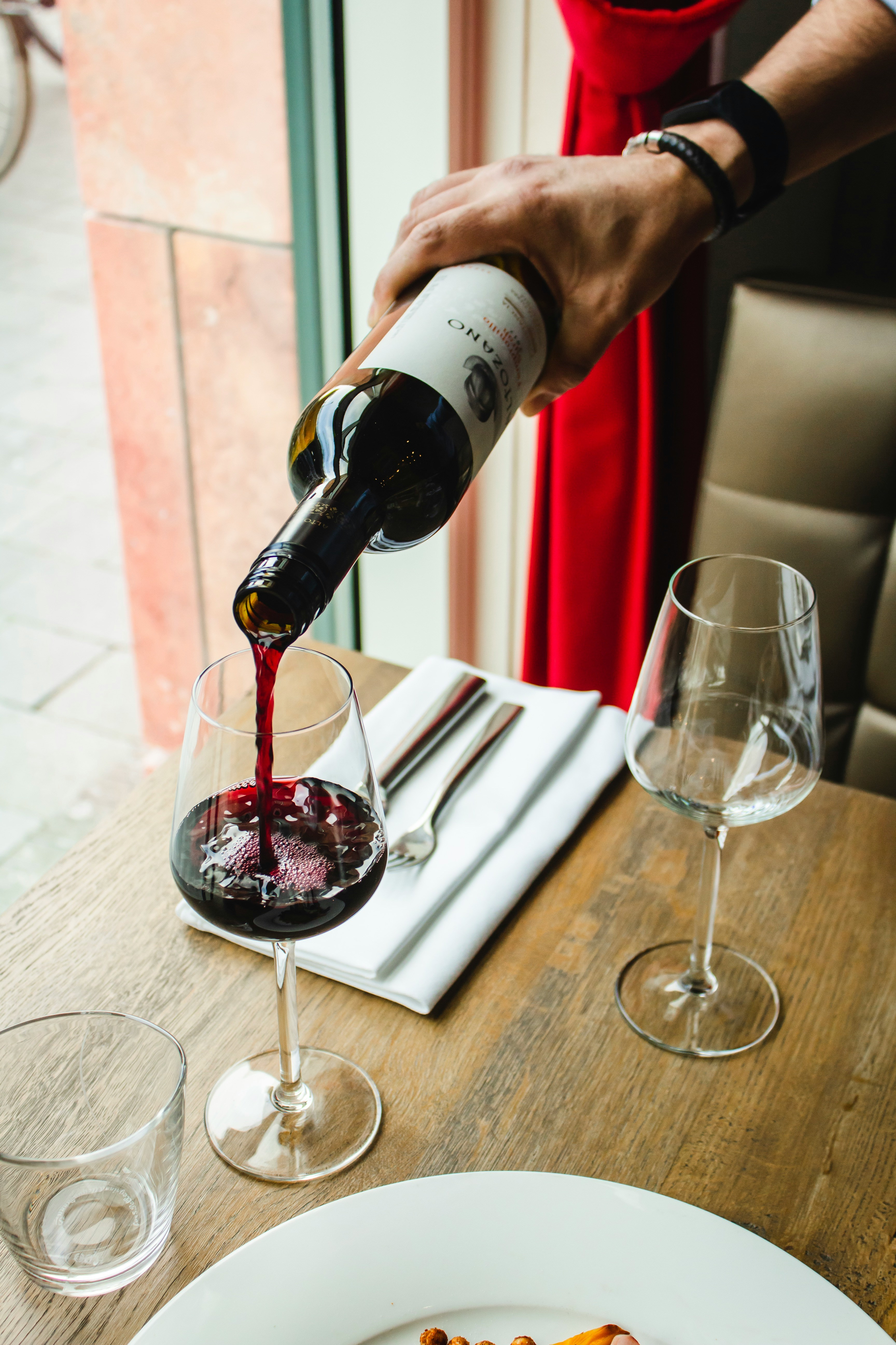 wine service at a fine dining, farm-to-table restaurant brand